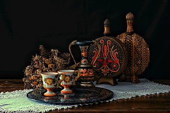 Traditional Embroidered Decor and Teacups on Wooden Table
