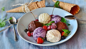 Colorful Ice Cream Sundaes With Fresh Berries And Mint