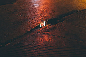 Nighttime street crack with glowing light reflection