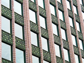 Modern Building Facade with Green Tile Patterns