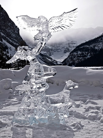 Ice Sculpture of Eagle and Deer in Snowy Mountain Landscape