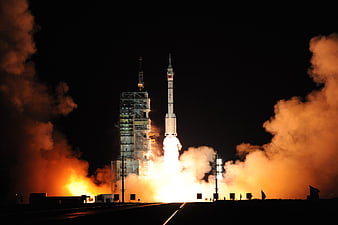 Long March Rocket Night Launch With Intense Orange Exhaust Plume
