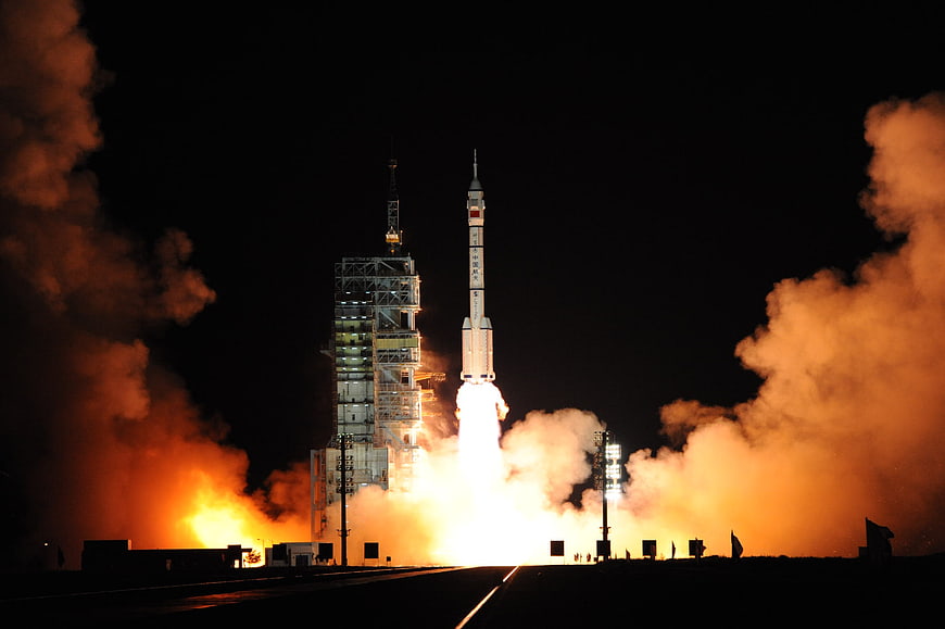 Long March Rocket Night Launch With Intense Orange Exhaust Plume