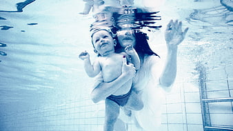 Underwater Portrait of Mother and Baby in Swimming Pool