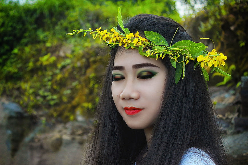 Woman with Yellow Flower Crown and Green Eye Makeup
