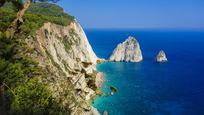 Dramatic coastal cliffs and sea stacks in Capri, Italy