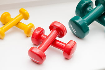 Colorful Dumbbells on White Background for Fitness