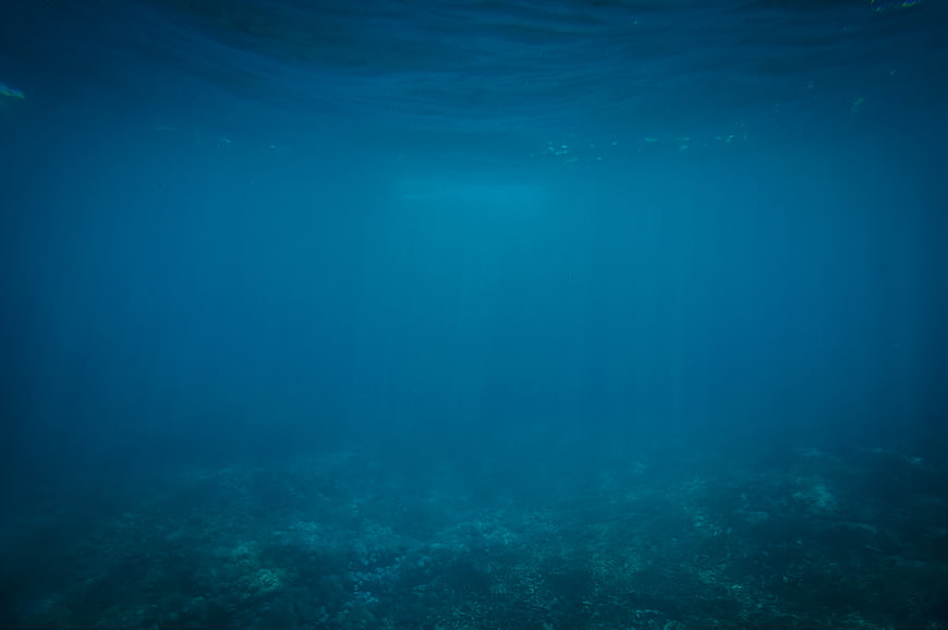 Deep Blue Underwater Ocean Scene with Sunbeams