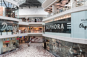 Interior of modern multi-level shopping mall with Sephora store