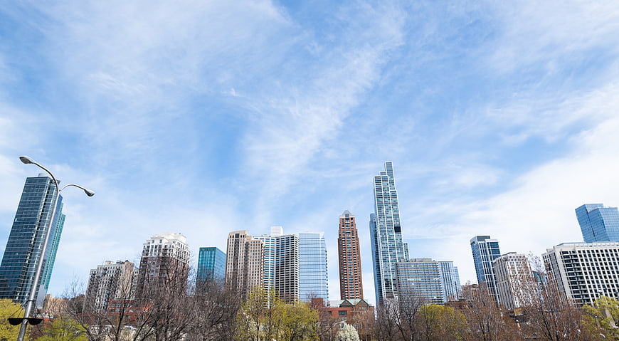 Modern City Skyline with Blue Sky and Clouds