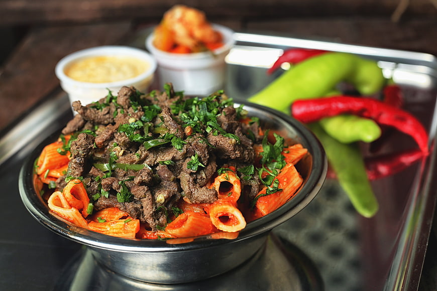 Egyptian Kebda Pasta Dish With Fresh Herbs And Peppers