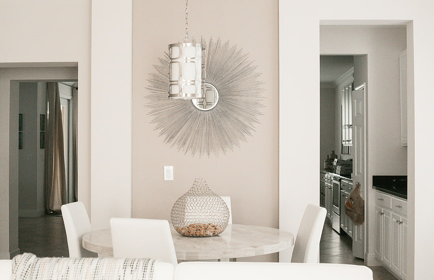 Modern Dining Room with Sunburst Mirror and Marble Table