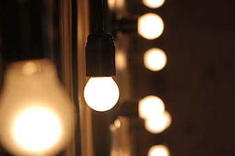 Glowing light bulbs with bokeh background