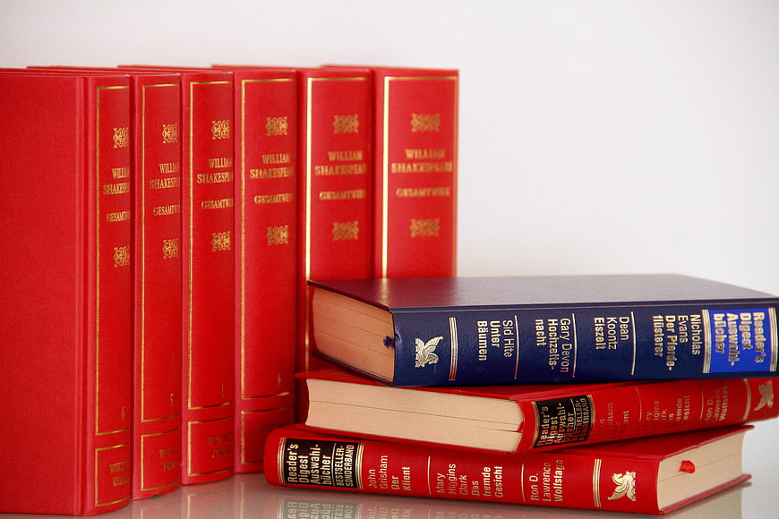 Red Shakespeare Collection And Stacked Reader's Digest Books