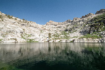 Serene Alpine Lake Surrounded by Granite Mountains