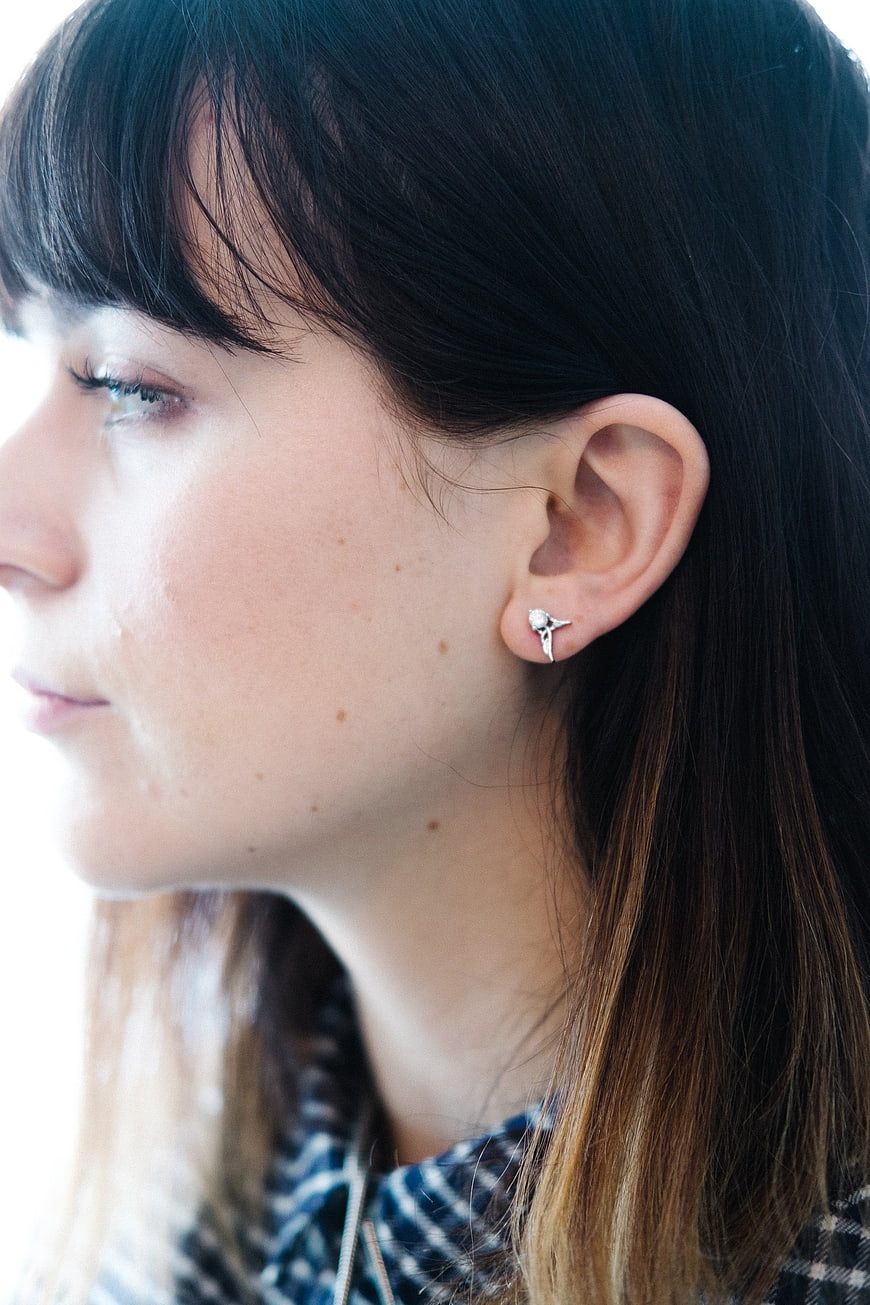 Close-up profile of woman with delicate silver earring