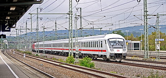 White and red Deutsche Bahn train at railway station