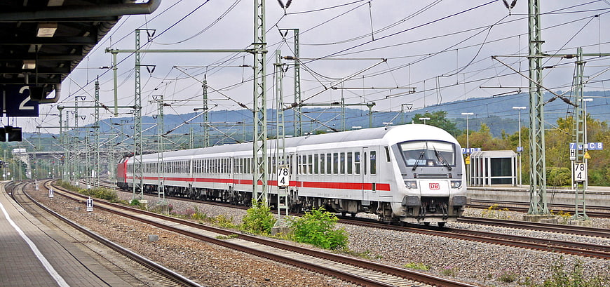 White and red Deutsche Bahn train at railway station