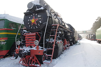 Vintage Soviet Steam Locomotive Covered in Snow