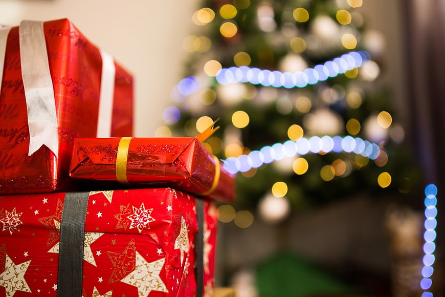 Red Christmas Presents with Bokeh Tree Lights Background