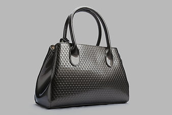 Glossy Black Textured Leather Handbag on Gray Background