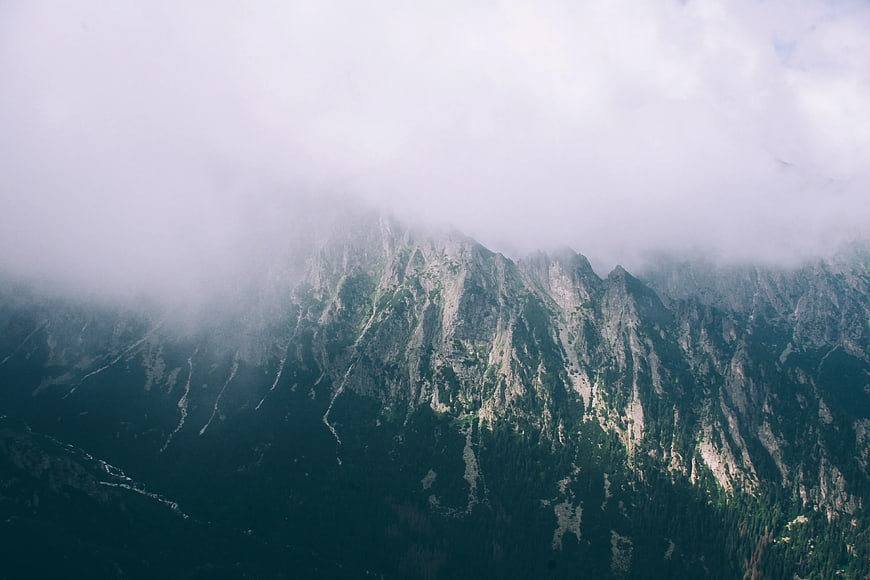 Misty Mountain Peaks Emerging from Thick Clouds