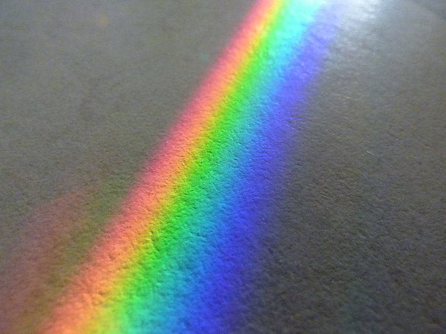 Rainbow light spectrum on textured gray surface