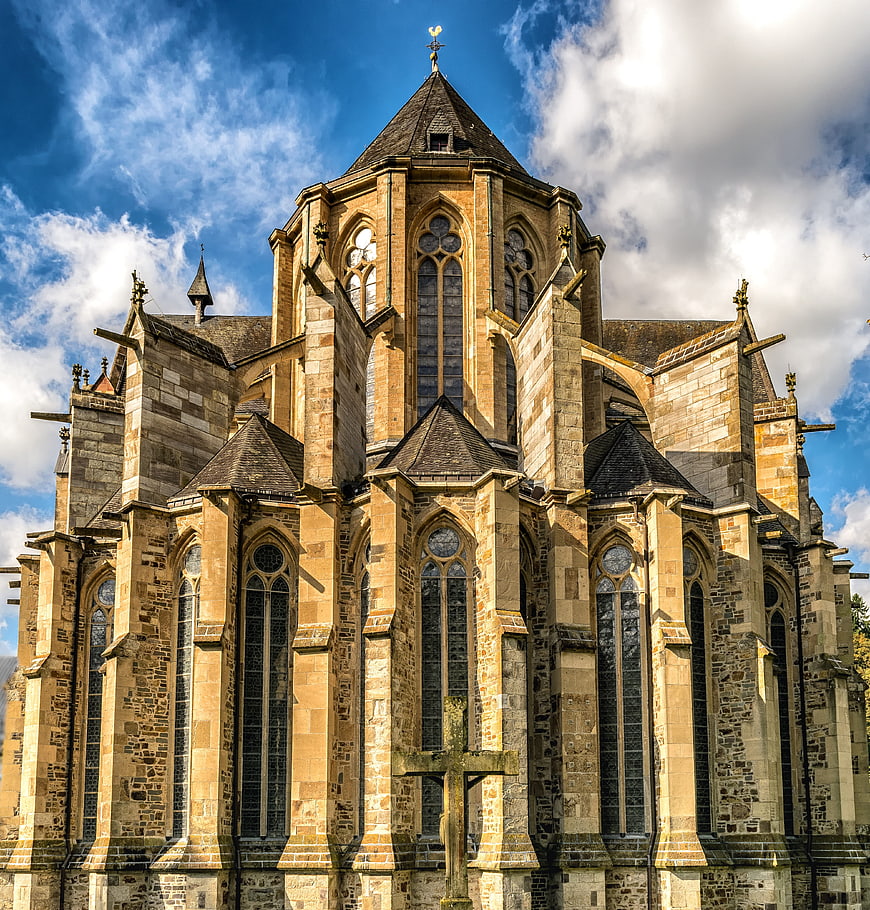 Gothic Cathedral Architecture with Blue Sky and Clouds
