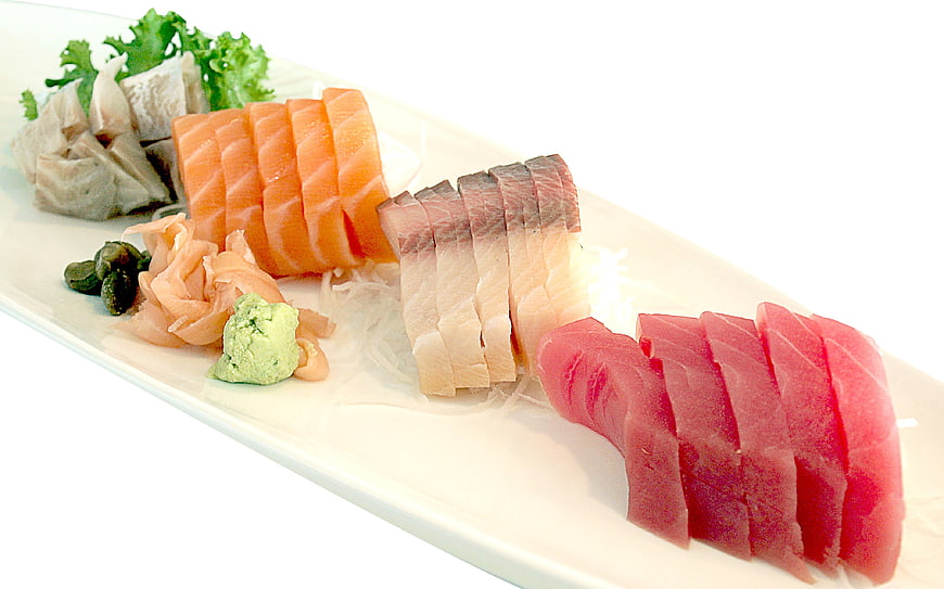 Assorted Sashimi Platter With Salmon, Tuna And White Fish On White Plate