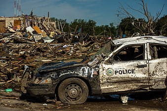 Devastated Police Car Amidst Tornado Destruction in Oklahoma