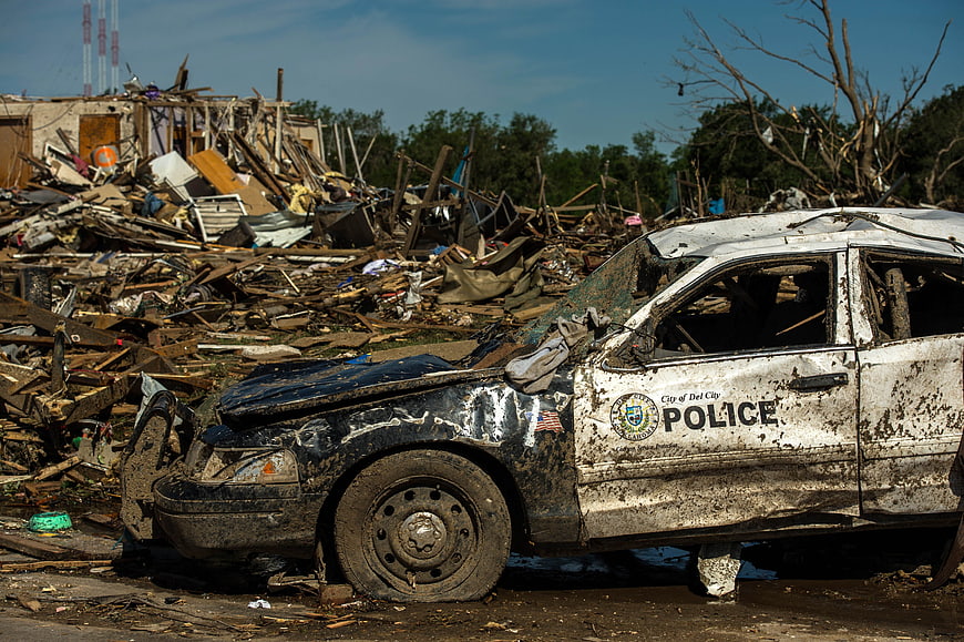 Devastated Police Car Amidst Tornado Destruction in Oklahoma