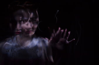 Woman Behind Glass With Ghostly Double Exposure Effect