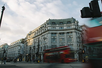 London street scene with red double-decker bus and architecture
