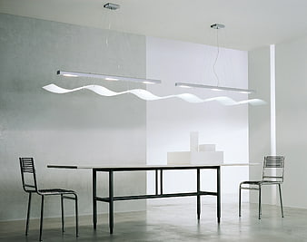 Modern minimalist dining room with wavy pendant lights