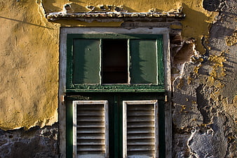 Weathered Green Window on Peeling Yellow Wall
