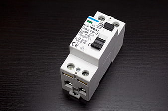 White DIN Rail RCD Circuit Breaker on Dark Surface