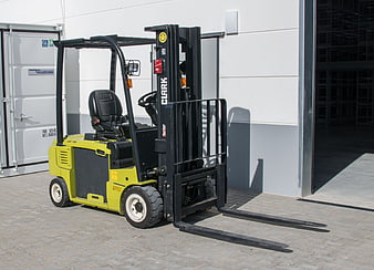 Yellow Clark Forklift Truck Parked Outside Industrial Warehouse Building