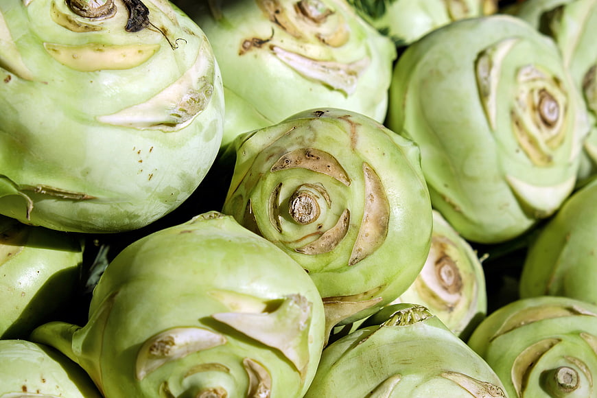 Close-up of fresh kohlrabi vegetables in a pile