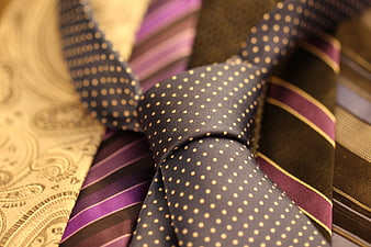 Close-up of patterned business neckties and cravats in a pile