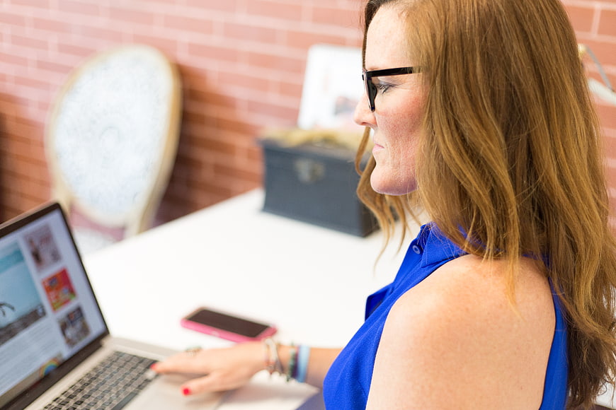 Woman Working on Laptop in Home Office