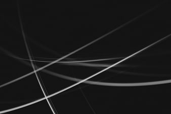 Abstract Black and White Light Streaks on Dark Background