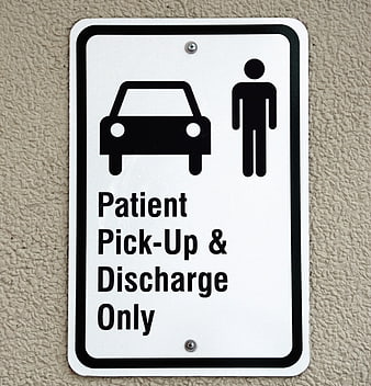 Patient Pick-Up and Discharge Only Sign on Wall