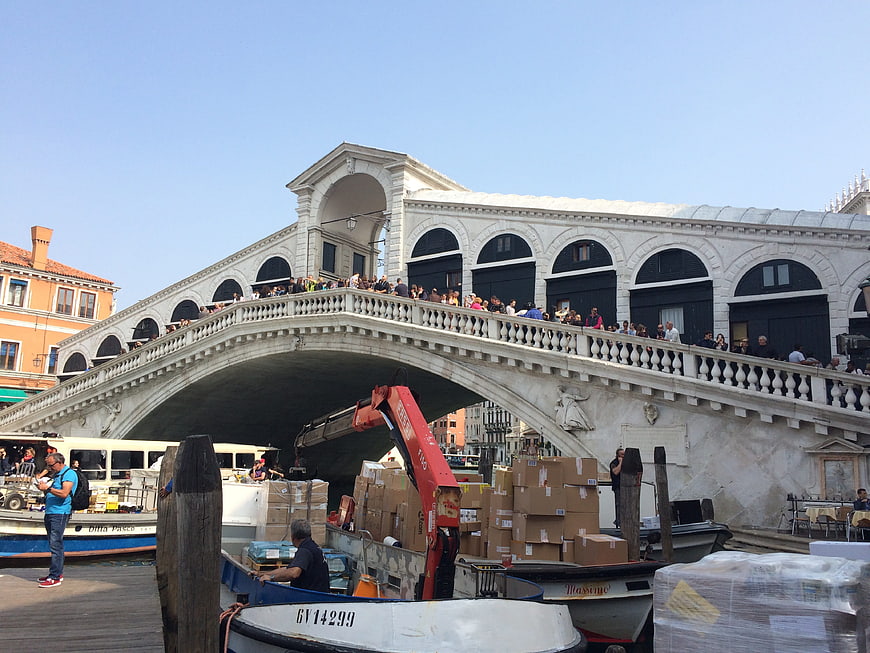 Rialto Bridge Venice Italy with Cargo Boats and Tourists