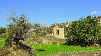 Abandoned stone ruin in Mediterranean countryside landscape