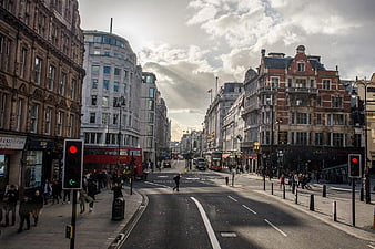 Busy London Street with Red Double-Decker Bus and Pedestrians