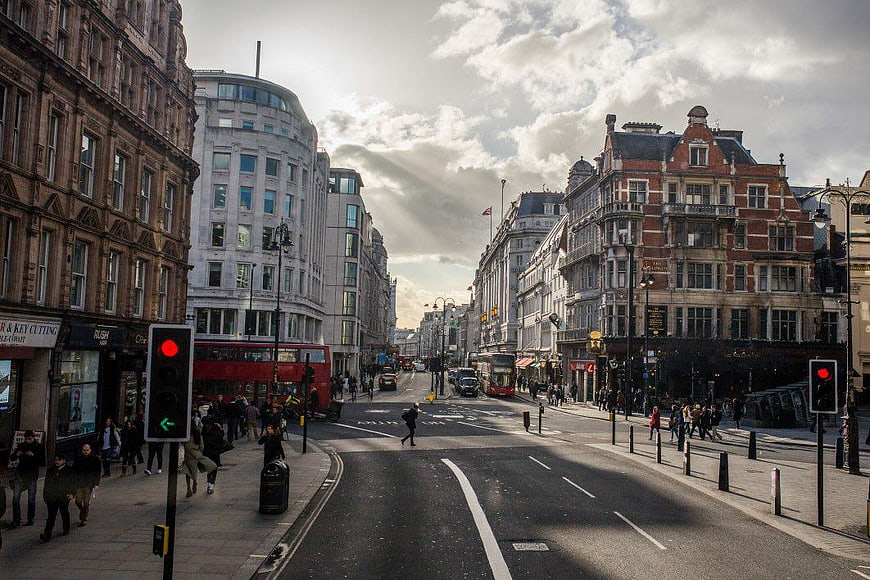 Busy London Street with Red Double-Decker Bus and Pedestrians