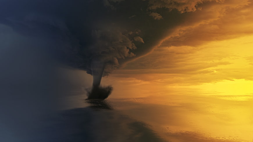 Dramatic Tornado Over Ocean At Sunset