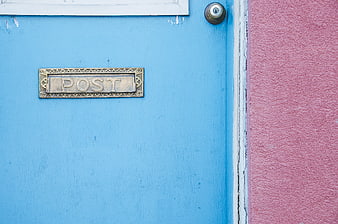 Blue Door with Brass Mail Slot and Pink Wall