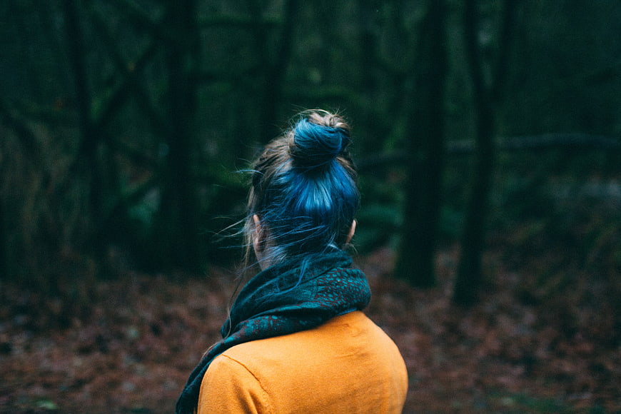 Woman with Blue Hair in Forest from Behind