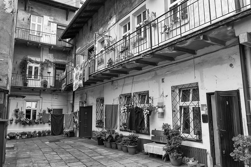 Black and white photo of a historic Krakow tenement courtyard